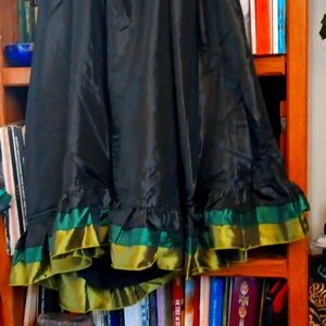 Black satin skirt with green trim